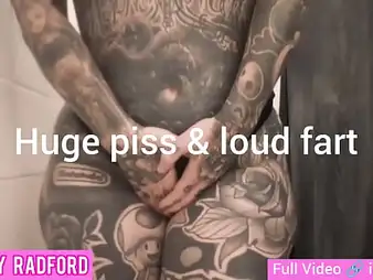 Melody Radford's inked physique gets soaked in piss and farts like a